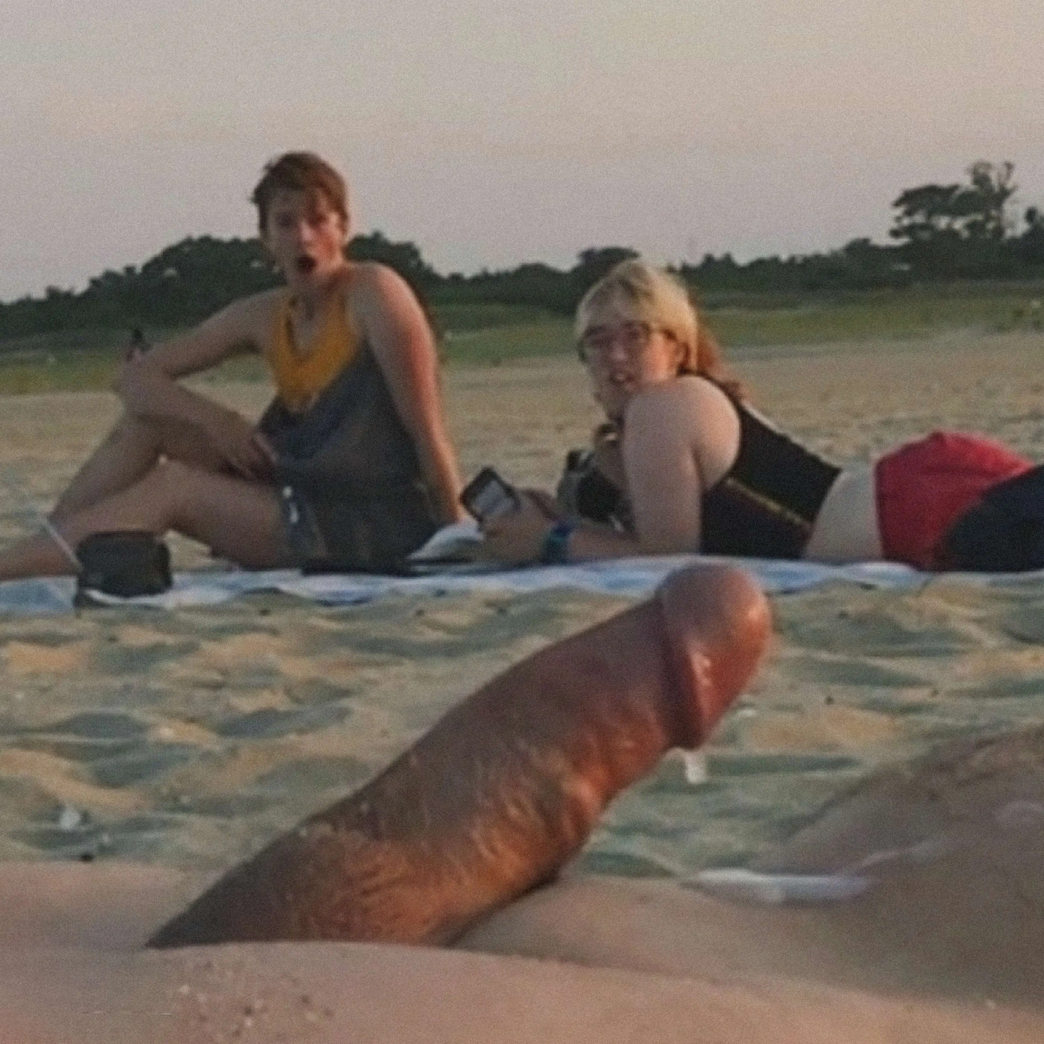 Friends shocked by cumshot on the beach