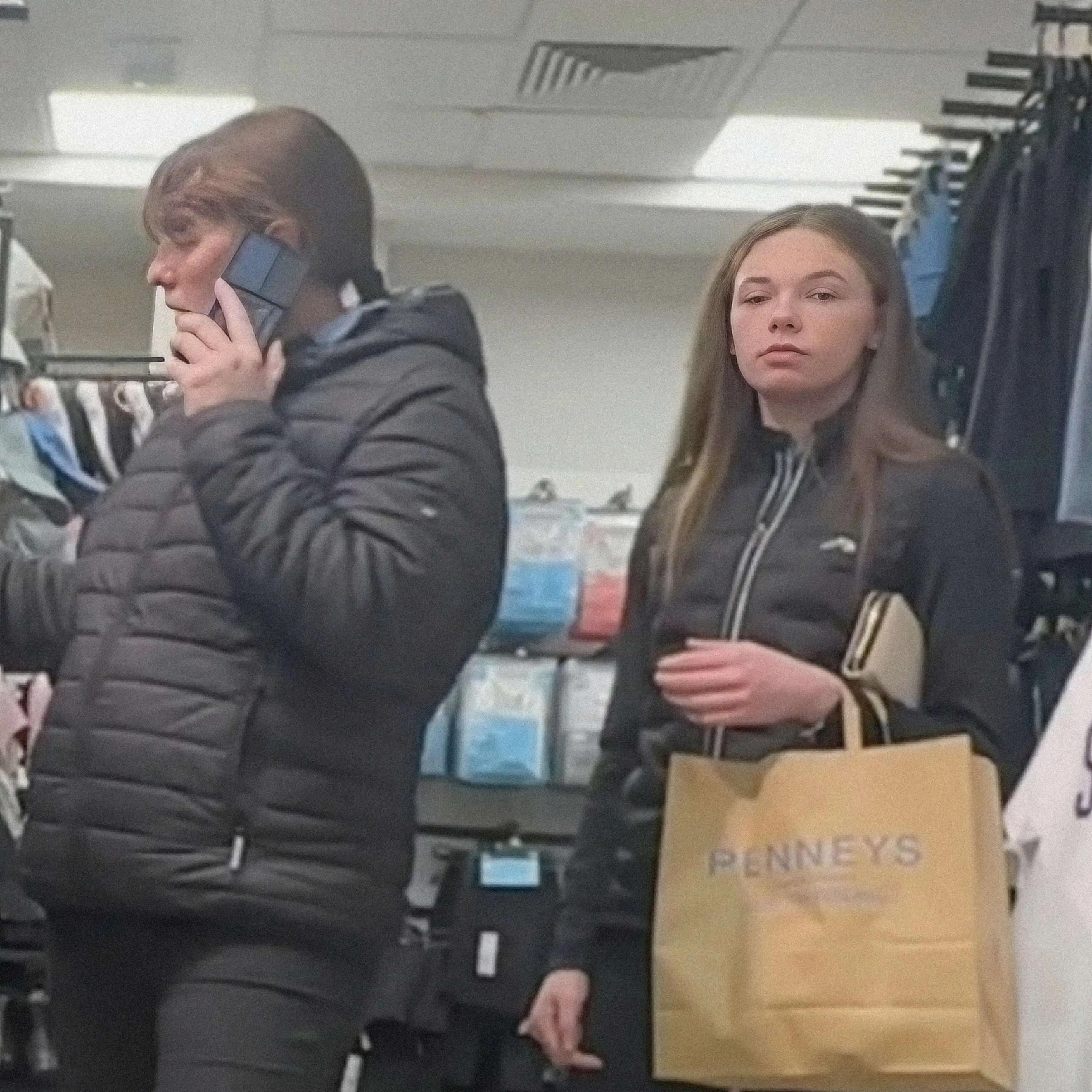 Shy teen looking at bulge in store